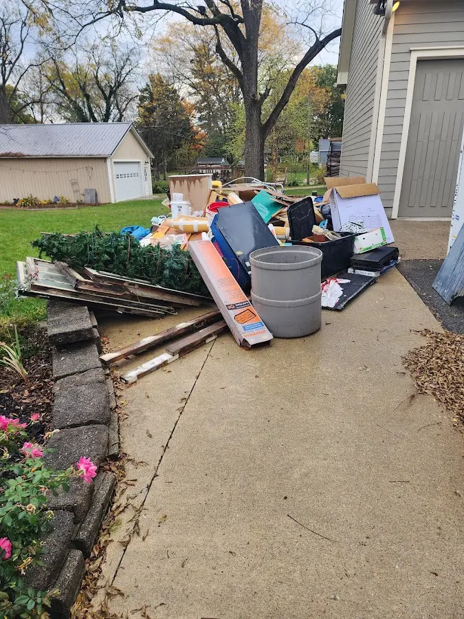 Dumpster being loaded with debris for Commercial Dumpster Rental in The Hammocks